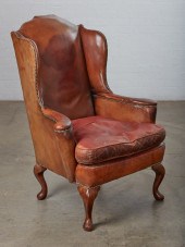 A GEORGE II STYLE BROWN LEATHE