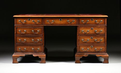 A GEORGE II STYLE WALNUT BURGUNDY