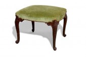 A GEORGE II UPHOLSTERED MAHOGA