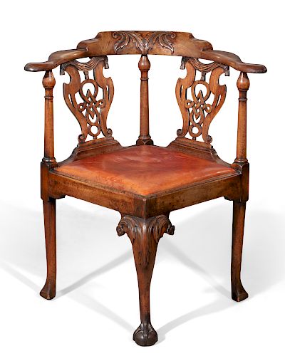 A GEORGE II WALNUT CORNER ARMCHAIR,