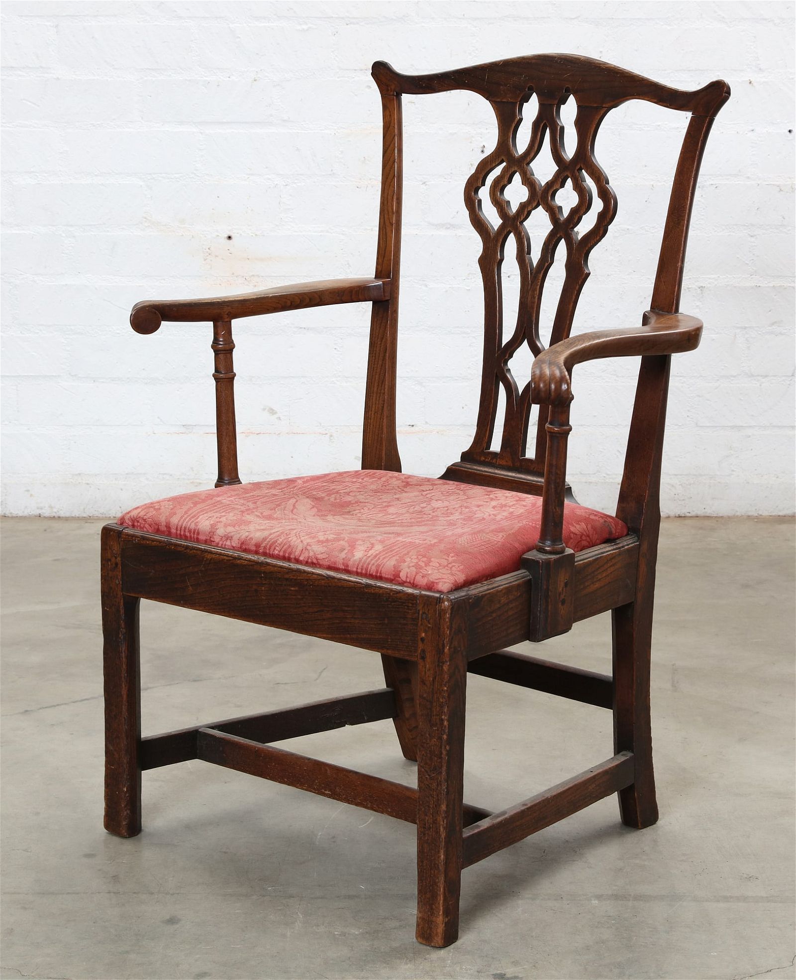 A GEORGE III ELM OPEN ARMCHAIRA