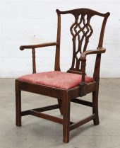A GEORGE III ELM OPEN ARMCHAIR