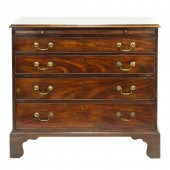 A GEORGE III MAHOGANY BACHELOR
