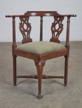A GEORGE III MAHOGANY CORNER C