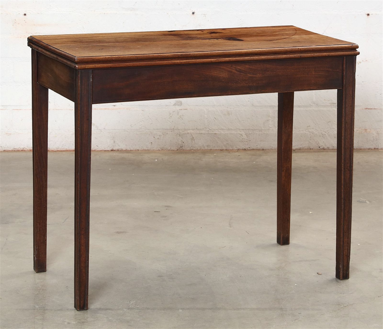 A GEORGE III MAHOGANY FOLD TOP