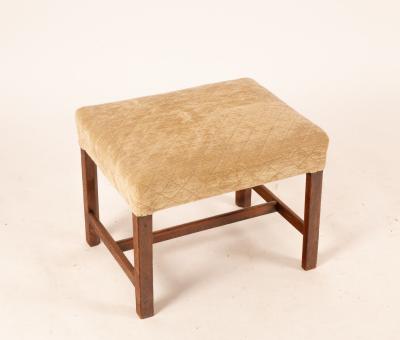 A George III mahogany stool,