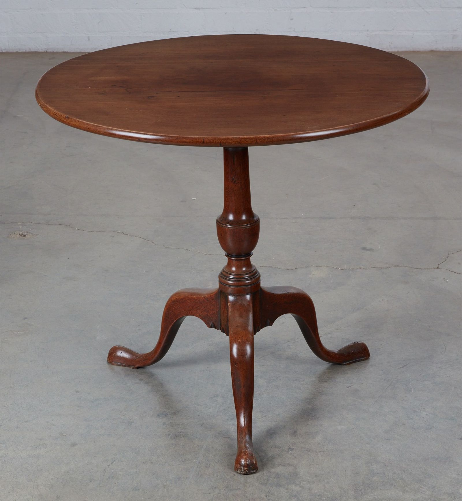 A GEORGE III MAHOGANY TILT TOP
