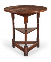 A GEORGE III OAK CRICKET TABLE