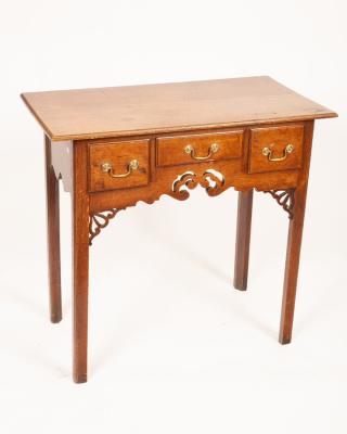 A George III oak lowboy, the