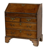 A GEORGE III OAK SLANT FRONT D
