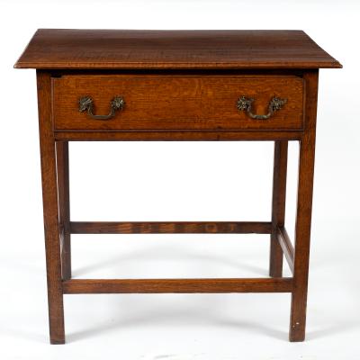 A George III oak table fitted a