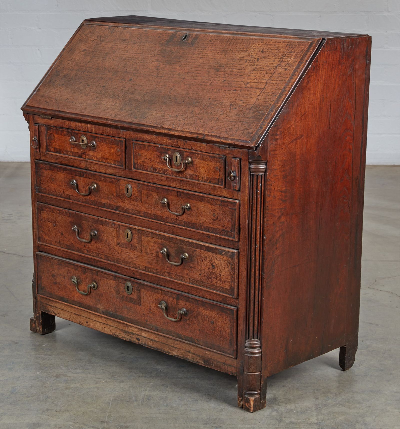A GEORGE III PROVINCIAL OAK SLANT