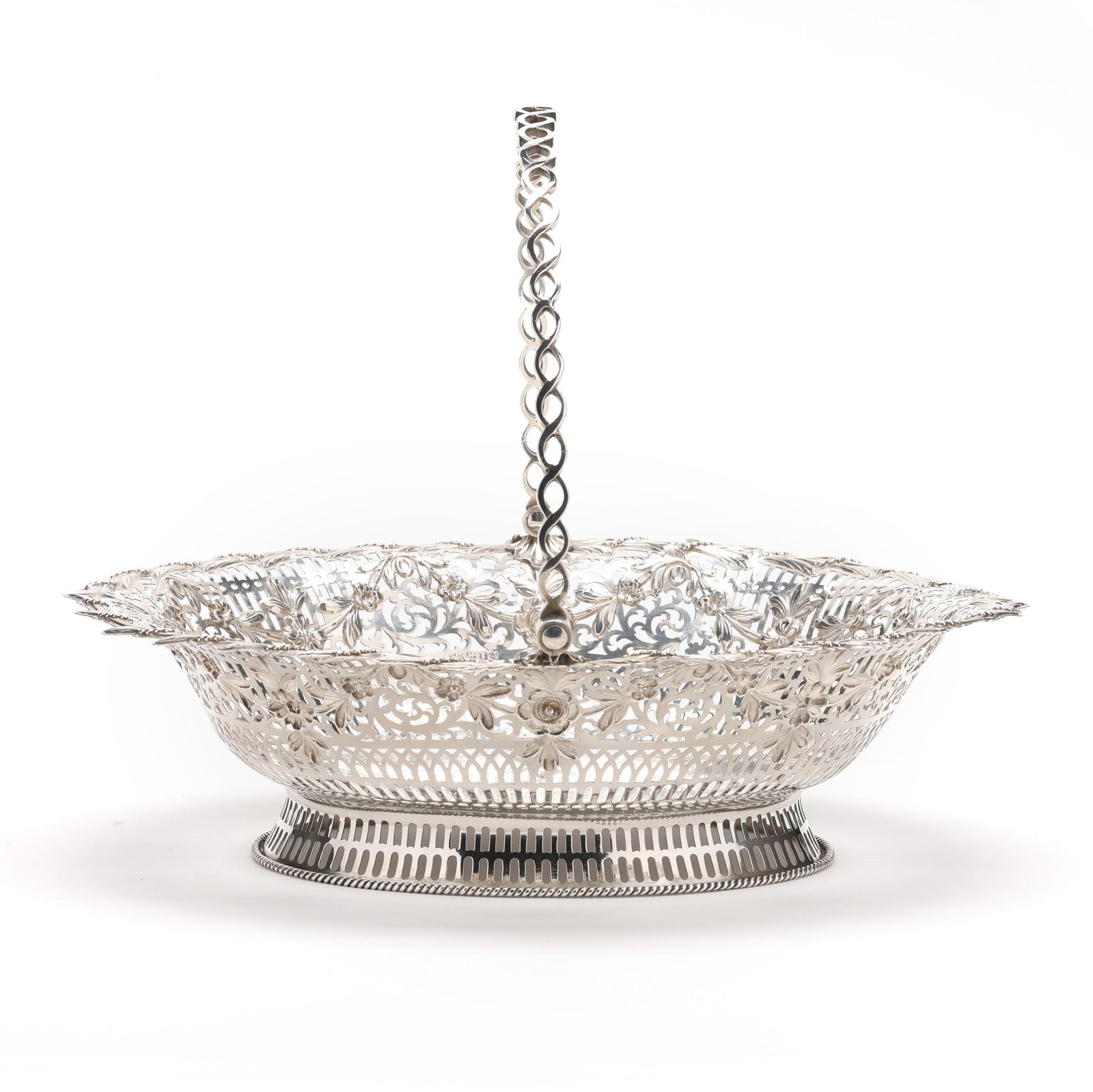 A GEORGE III SILVER CAKE BASKET,