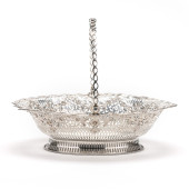 A GEORGE III SILVER CAKE BASKE