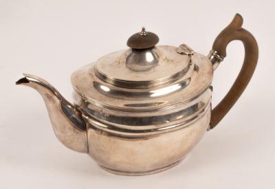 A George III style silver teapot,
