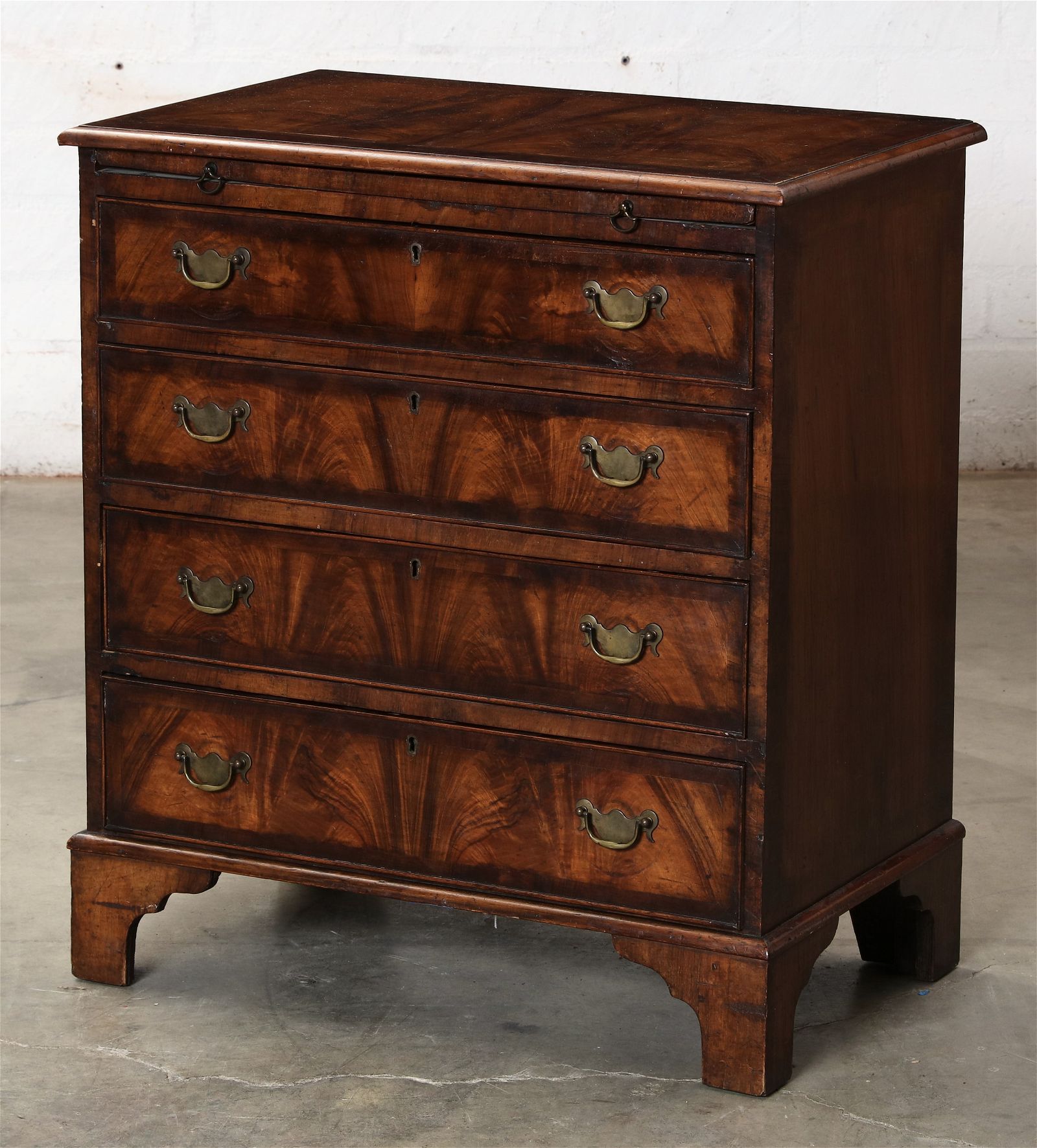 A GEORGE III STYLE WALNUT BACHELORS