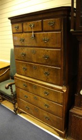 A George III walnut chest on c