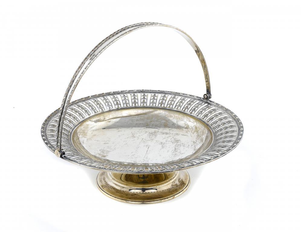 A GEORGE V CAKE BASKET with swing
