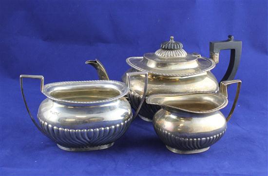 A George V demi fluted silver three
