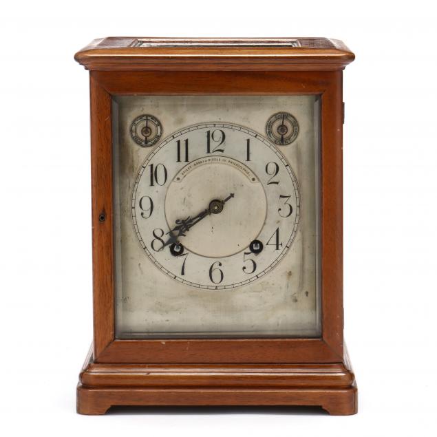 A GERMAN BRACKET CLOCK, RETAILED