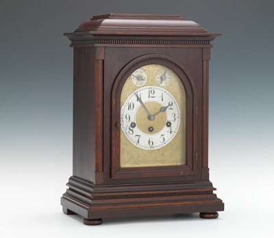 A German Junghans Mahogany Shelf