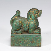 A GILDED BRONZE STATUE OF AN A