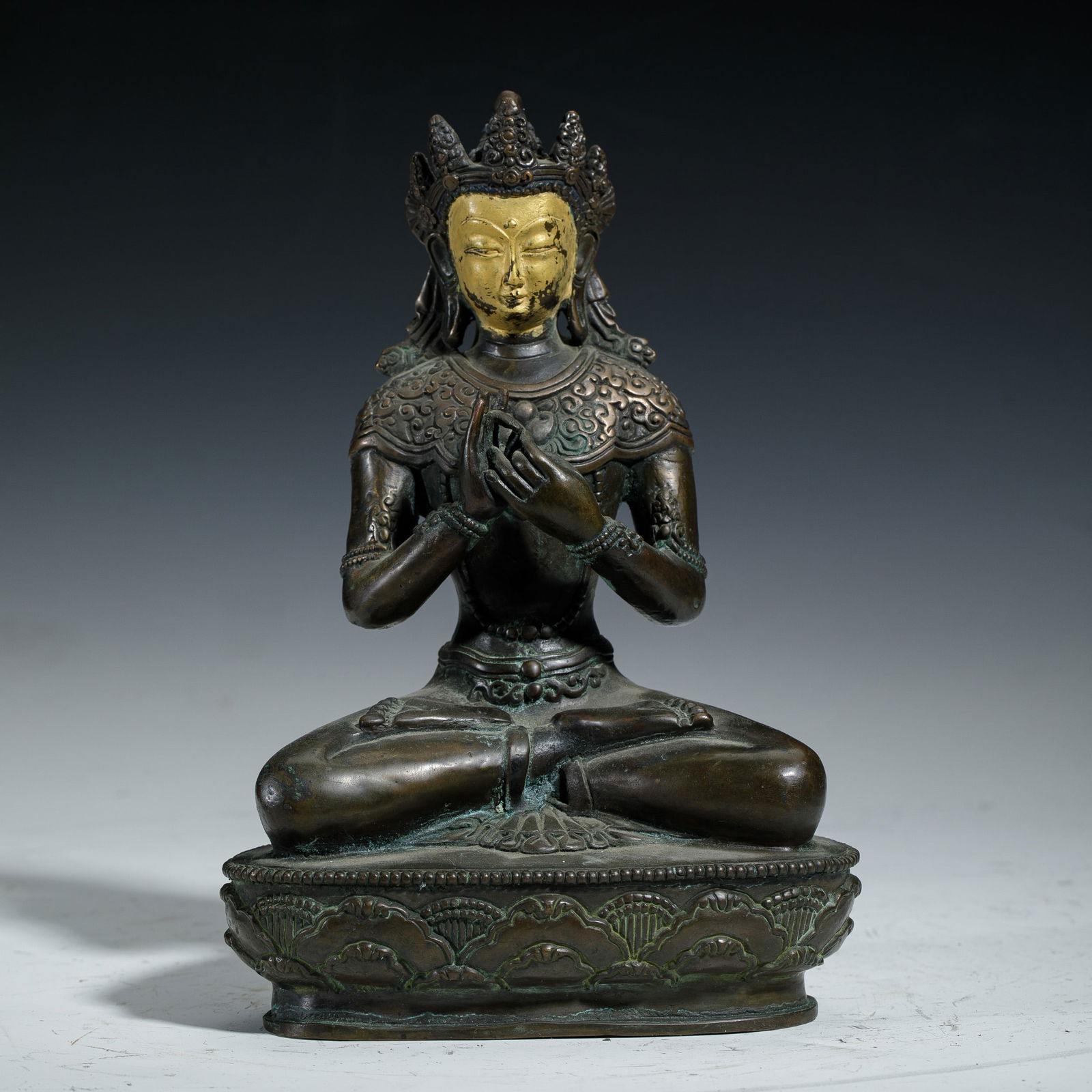 A GILDED - FACED TIBETAN BUDDHIST