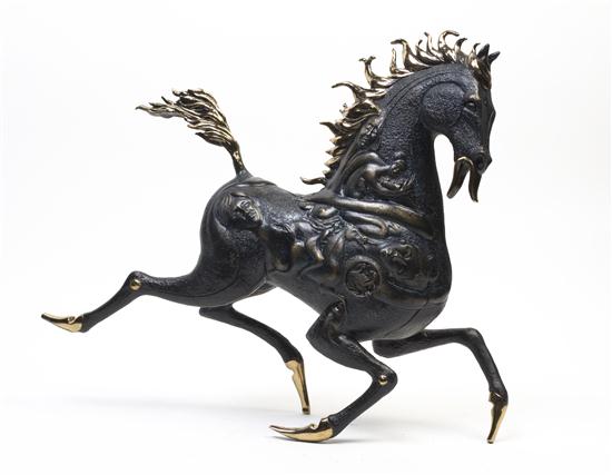 *A Gilt and Patinated Bronze Figure