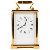 A GILT BRASS 8-DAY CARRIAGE CL