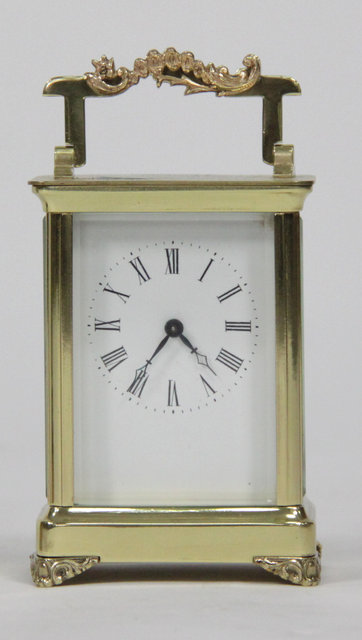 A gilt brass carriage time-piece