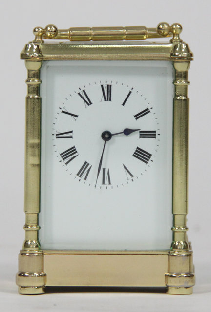 A gilt brass carriage time-piece