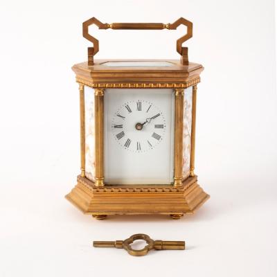 A gilt brass mantle clock set