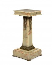 A GILT-BRONZE AND ONYX PEDESTA