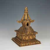 A GILT - BRONZE BUDDHIST PAGOD