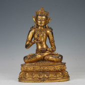 A GILT - BRONZE BUDDHIST STATU