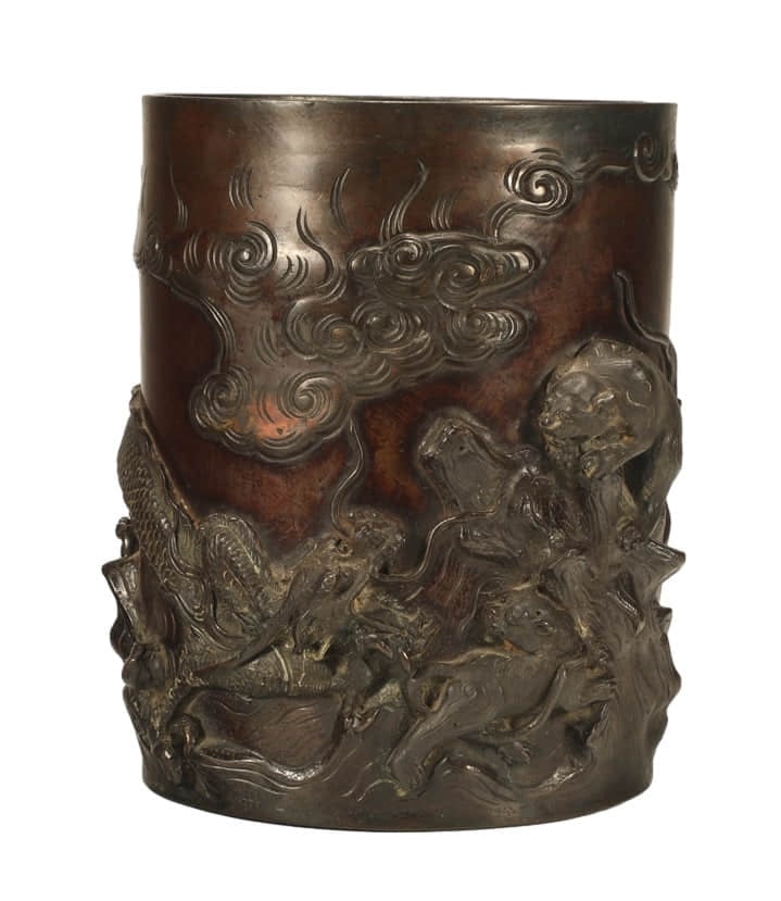 A GILT-BRONZE CARVED 'DRAGON FIGHTS
