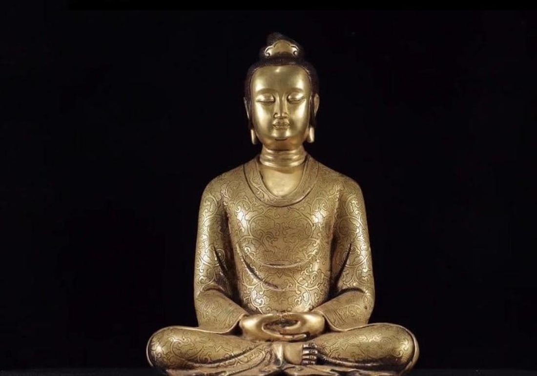 A GILT BRONZE ENGRAVED SITTING