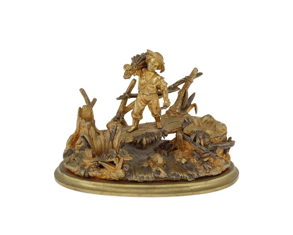 A GILT-BRONZE FIGURAL INKWELLA