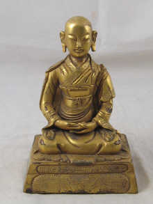 A gilt bronze figure of Buddha