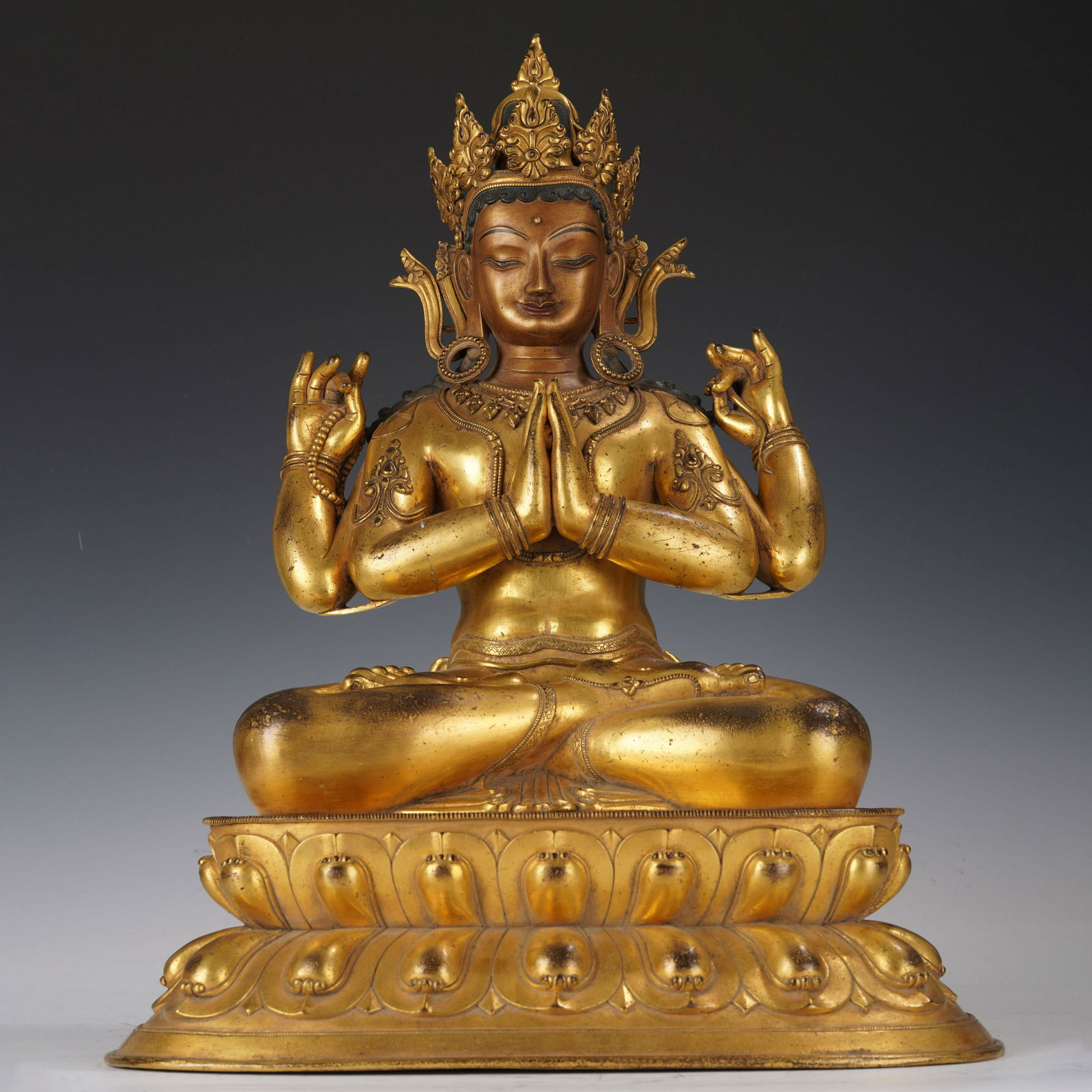 A GILT BRONZE FIGURE OF BUDDHA