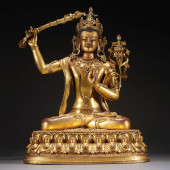A GILT BRONZE FIGURE OF BUDDHA