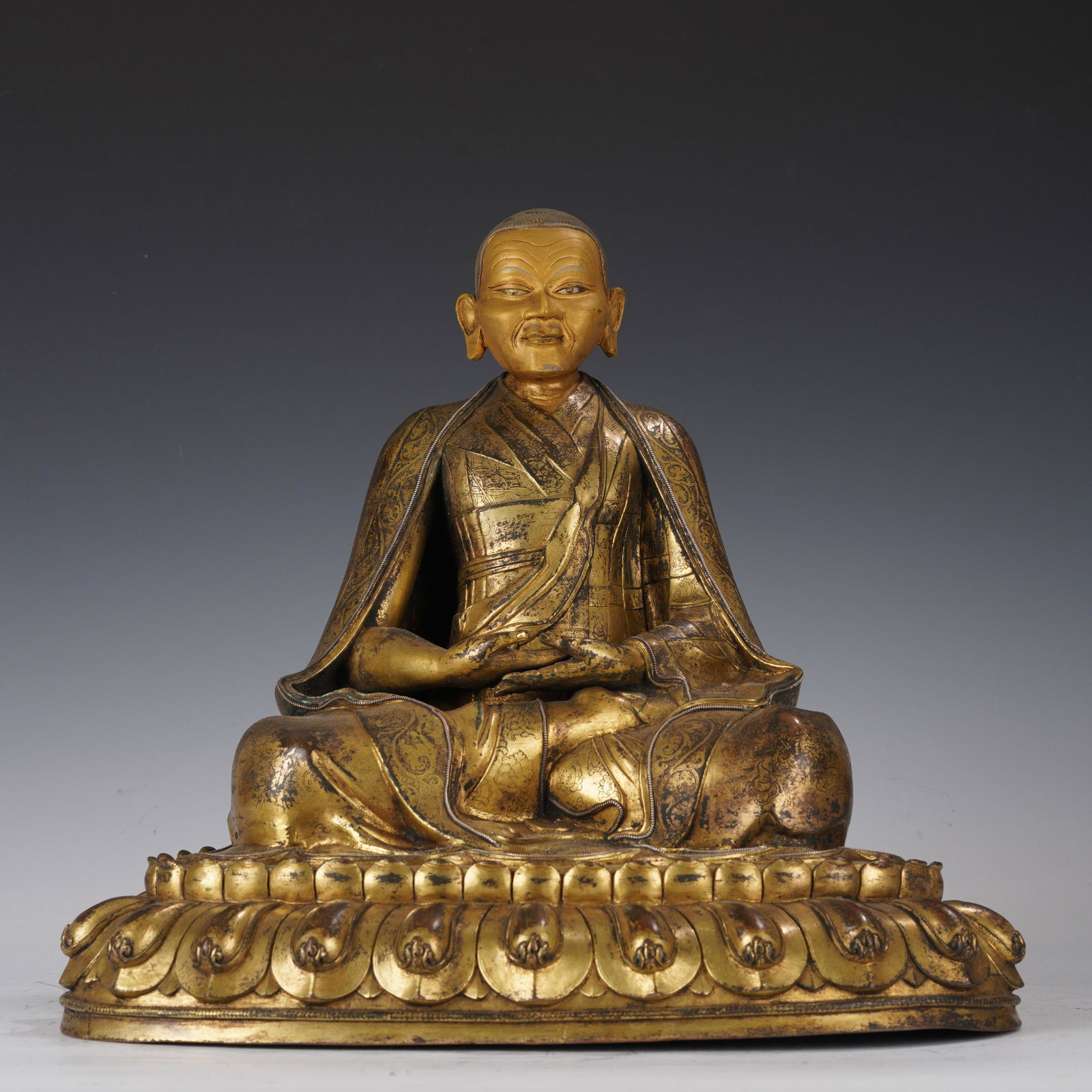 A GILT BRONZE FIGURE OF BUDDHA