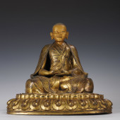 A GILT BRONZE FIGURE OF BUDDHA