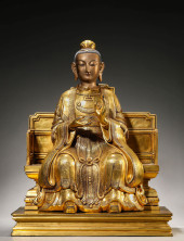 A GILT-BRONZE FIGURE OF BI XIA