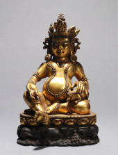 A GILT-BRONZE FIGURE OF JAMBHA