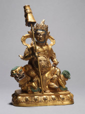 A GILT-BRONZE FIGURE OF JAMBHA