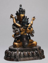 A GILT-BRONZE FIGURE OF MANJUS