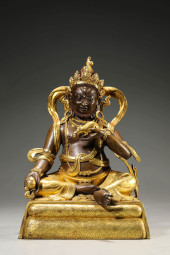 A GILT-BRONZE GOD OF WEALTH FI
