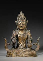 A GILT-BRONZE GUANYIN SEATED F