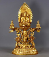 A GILT BRONZE HAND-CHISELED BU